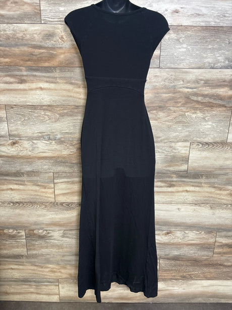 Front view of black maternity cap-sleeve maxi dress showing empire waist and long skirt on mannequin on wood background