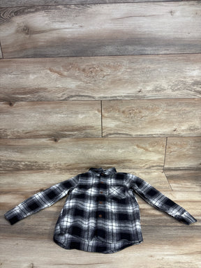 Black and white plaid long-sleeve button-up kids shirt on wood background at children's resale store