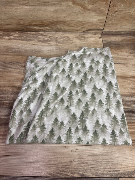 Top view of Copper Pearl stretchy 5 in 1 multi use cover showcasing gray tree print on a wood surface