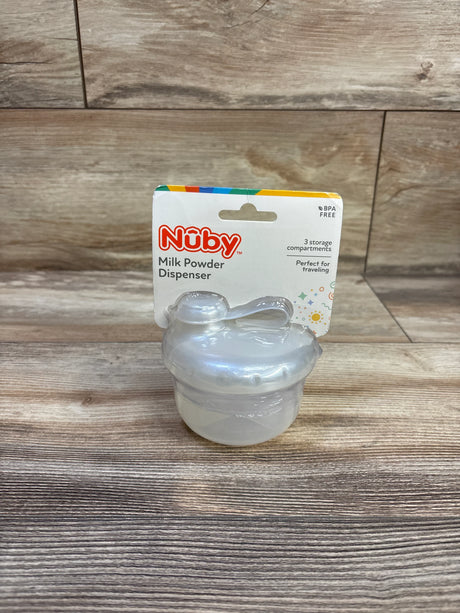 Front view of Nuby dispenser showcasing three translucent stacked compartments and lid with handle on wood background