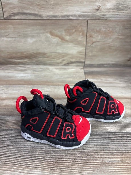 Three-quarter view of Nike Air More Uptempo TD Red Toe sneakers showing black uppers, red toe caps and AIR lettering