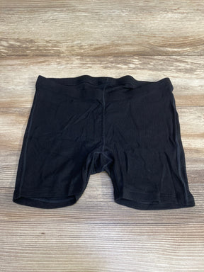 Front flat lay of black Gap maternity rib PJ shorts showing elastic maternity waistband and ribbed fabric on wood background