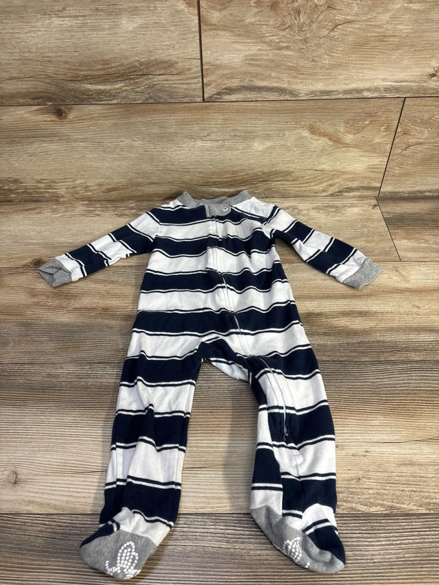 Flat lay of Burt's Bees Baby sleeper 6-9 months, navy and white stripes, front zipper, gray grippy feet on wood