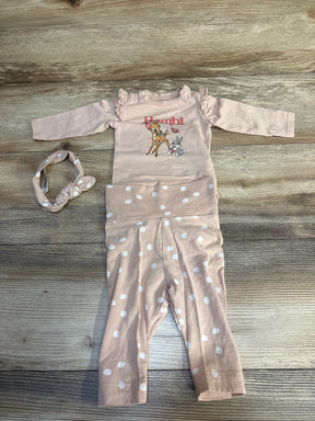 Pink baby outfit set with Bambi graphic, polka dot pants, and matching headband on wood background