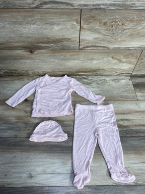 Light pink soft cotton baby outfit set with long sleeve wrap top, footed pants, and hat on wooden floor