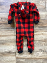 Red and black buffalo plaid fleece baby onesie with hood shaped like a bear, on wooden floor