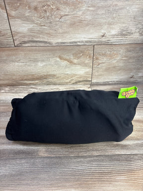 BubbleBum inflatable booster seat in black storage pouch, compact folded on wood-grain surface