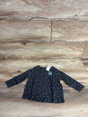 Flat lay of Old Navy long-sleeve grey toddler shirt (12-18M) showcasing white polka dot print and retail tag on wood plank background