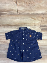 Top-down navy American Hawk button-up shirt (24M) with small white print, chest pocket with tan patch on wood floor
