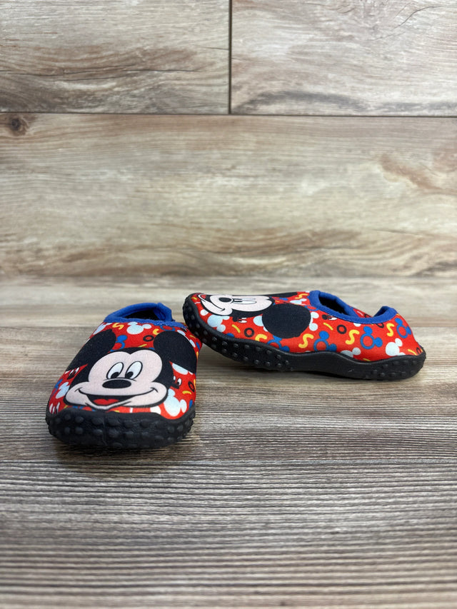 Mickey Mouse toddler shoes with red print, blue trim, non-slip soles on wood floor