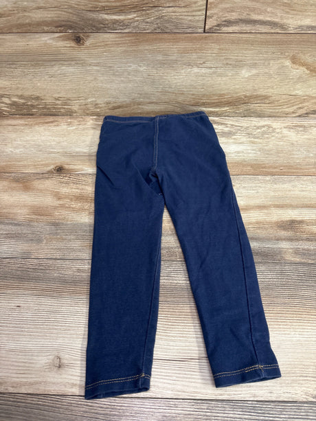 Front view of Koala Kids navy jeggings in size 4T showcasing an elastic waistband and contrast stitching on a wood background