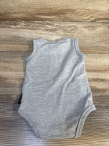 Gray sleeveless baby bodysuit on wood background, gently used kids clothing