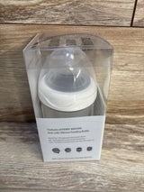 Perry Mackin anti-colic silicone baby feeding bottle in clear packaging on wooden surface