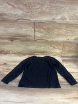 Back view of black Marvel The Punisher long sleeve shirt in size 3T showing its plain back on wood flooring