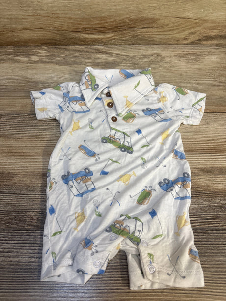 Baby romper with golf print, wooden buttons, and collar on wood background