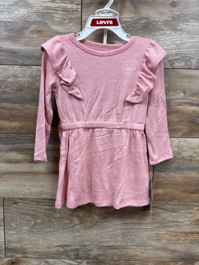 Pink long sleeve toddler dress with ruffle shoulders and Levi's logo on wooden background