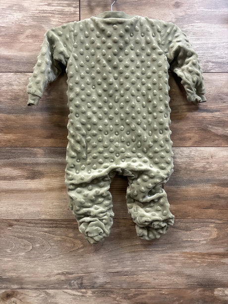 Sage green Kyle & Deena minky dot baby sleeper for 6-9 months on a wooden background