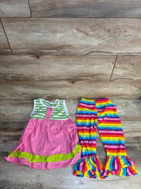 Girls pink dress with green stripes and ruffles, paired with rainbow striped ruffle pants