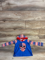 Front view of baby hooded rash guard with American flag skull on blue body, stars and stripes hood and sleeves on wood floor