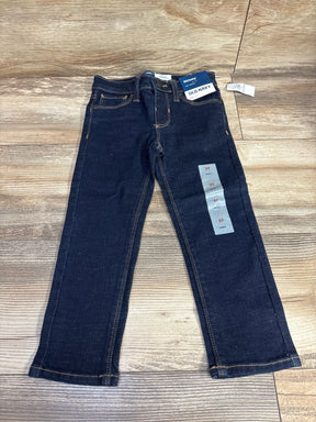 Dark wash Old Navy skinny jeans for toddlers, size 3T, laid flat on wood floor