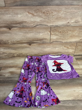 Purple Halloween pajama set with witch cat, ghosts, and bats for kids