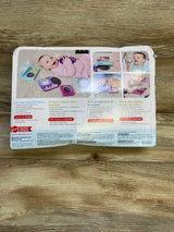 Back of Fisher-Price Mini Me Moments DJ Gift Set box showing toy record player, microphone and rattle on wooden floor