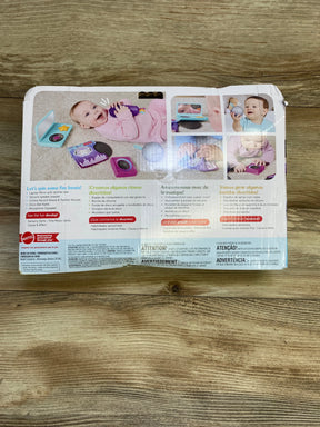 Back of Fisher-Price Mini Me Moments DJ Gift Set box showing toy record player, microphone and rattle on wooden floor