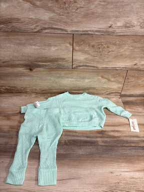 Aqua ribbed toddler lounge set with long sleeve top and pants on wood background