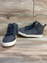 Kids dark gray high top sneakers with white soles on wood background