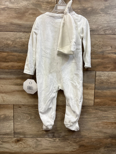 Front view of white velvet Little Prince coverall and matching hat set with long sleeves and footed legs on a wood background