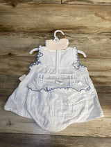 White baby dress and bloomers set with blue trim on wooden background, gently used kids clothes