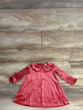 Red velvet long-sleeve baby dress with ruffled collar and gold heart print on wooden floor