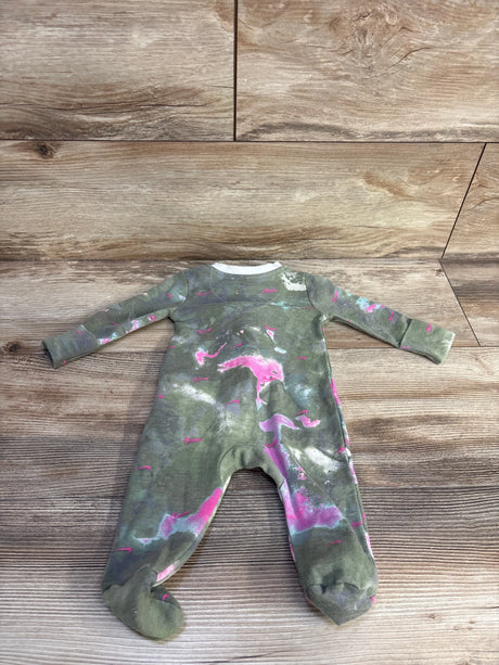Flat lay of Nike baby footed sleeper, size 3 months, showing green tie-dye with pink and white splashes on wood background