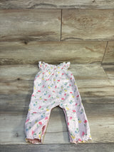 Flat lay of Janie and Jack floral eyelet ruffle jumpsuit in pink with multicolor flowers and ruffle straps on wood plank floor