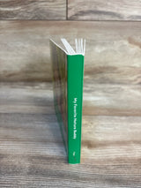 My Favorite Nature Buddy kids book with green spine on wood floor