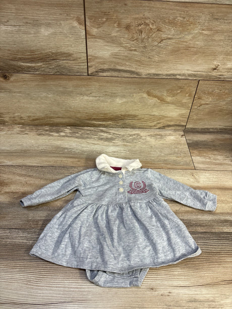 Front view of Carter’s grey polo bodysuit dress, size 3m, with long sleeves, collar, and attached bottom on wood floor