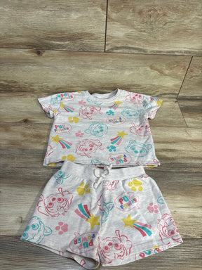 Flat lay gray Paw Patrol two-piece shirt and shorts set with all-over Pup Power print and drawstring waist on wood background