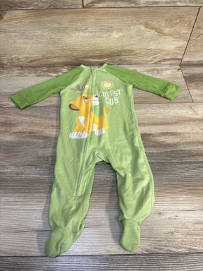 Front view of green Disney Baby Lion King footed sleeper with front zipper and Cutest Cub graphic on wood floor