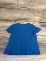 Blue short sleeve toddler t-shirt laid flat on wood floor