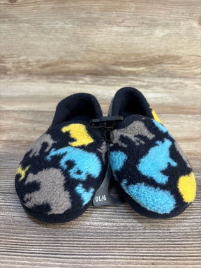 Fleece baby slippers with blue, yellow, and gray animal print on wood background