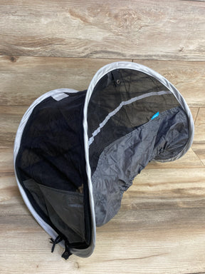 Black and gray stroller canopy with mesh panel on wood floor, baby gear accessory