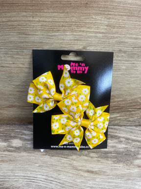 Front view of two yellow daisy-print hair bows (2-pack) showing fanned layered shape on black display card