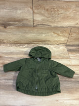 Old Navy hooded utility jacket in green for infants, size 0-3m, on a wood-grain surface.