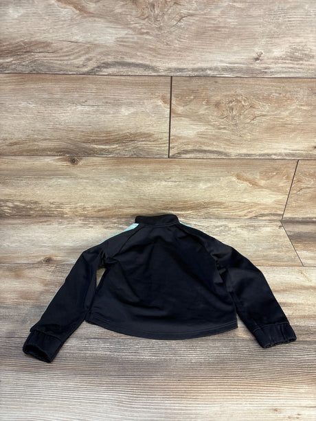 Black long sleeve kids jacket with light blue shoulder accents on wood floor