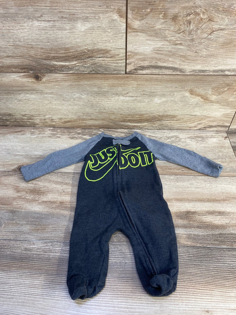 Flat lay of Nike sleeper, dark gray with lighter gray sleeves, neon yellow 'JUST DO IT' logo, front zipper, footed