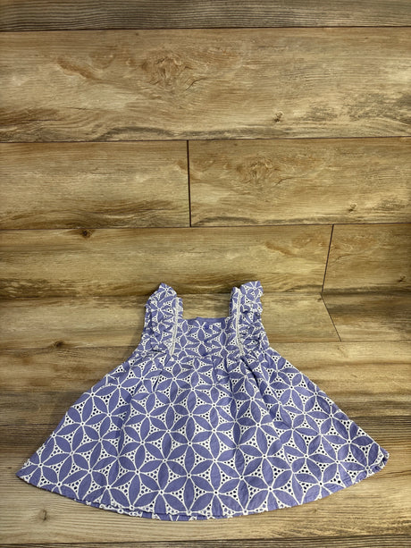 Flat lay front of Janie and Jack petal dress 3T showing purple eyelet fabric and ruffled shoulder straps on wood background