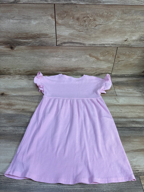 Front view of a pink ribbed Old Navy dress with ruffled short sleeves and gathered waist on a wood-patterned surface