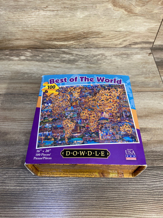 Top down of 100 piece Dowdle Best of the World puzzle box showing colorful world map artwork and logo on wood surface