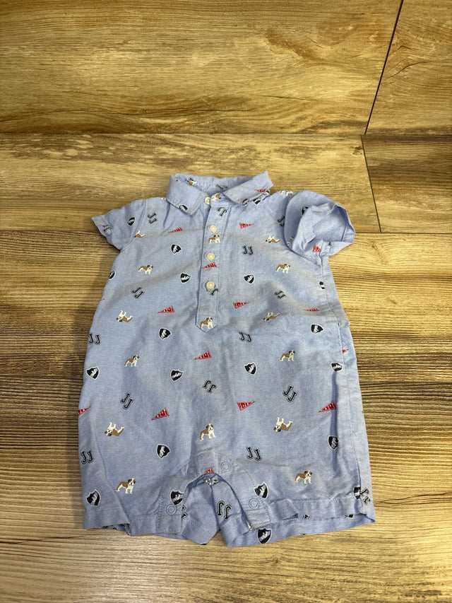 Flat lay of blue Janie & Jack oxford baby romper with bulldog print, short sleeves, front buttons and snap crotch on wood