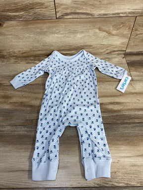Carter's white floral baby romper with long sleeves on wood floor